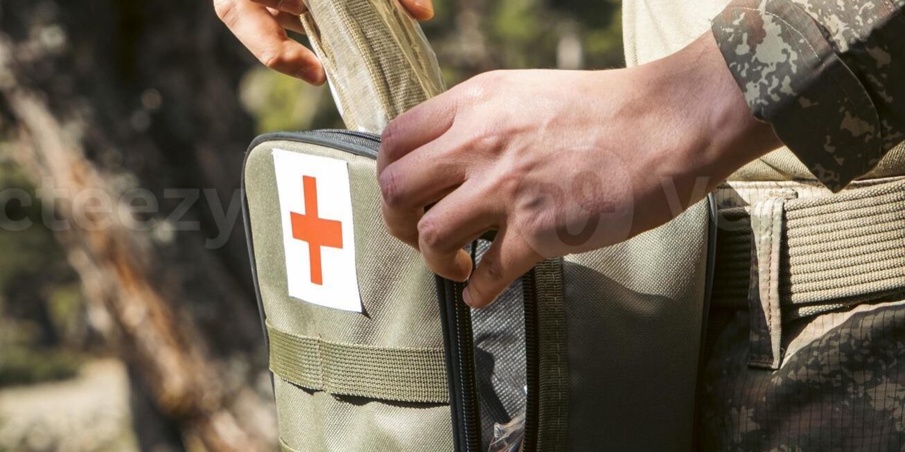 military-army-first-aid-kit-camouflaged-soldier-medic-photo